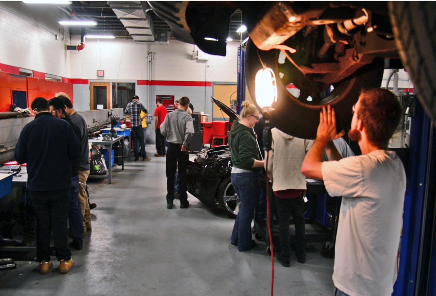 Automotive Tech under car
