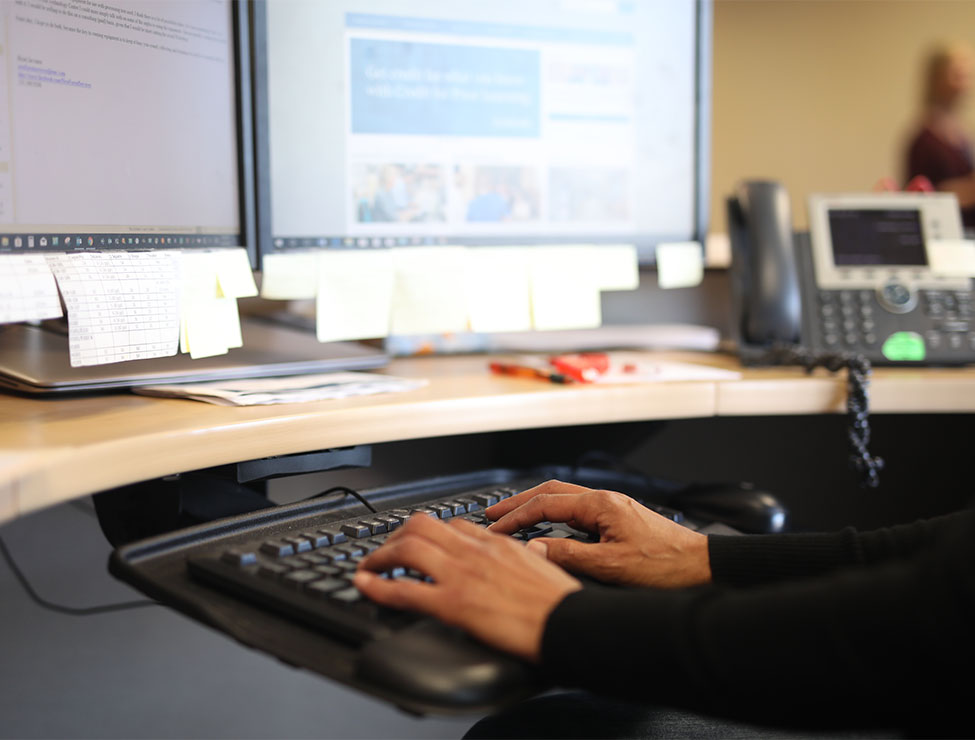 Close up of hands on computer keyboard