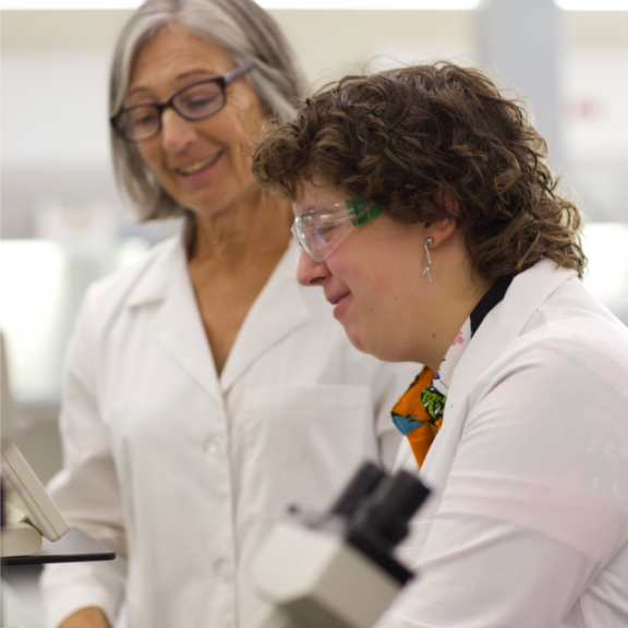 Instructor working with biotechnology student