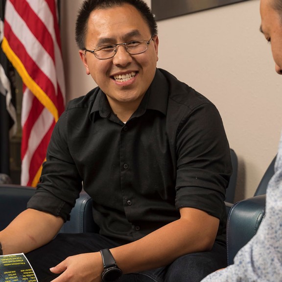 Faculty member talking with student in office