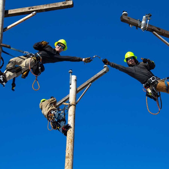 Electricians working on phone lines
