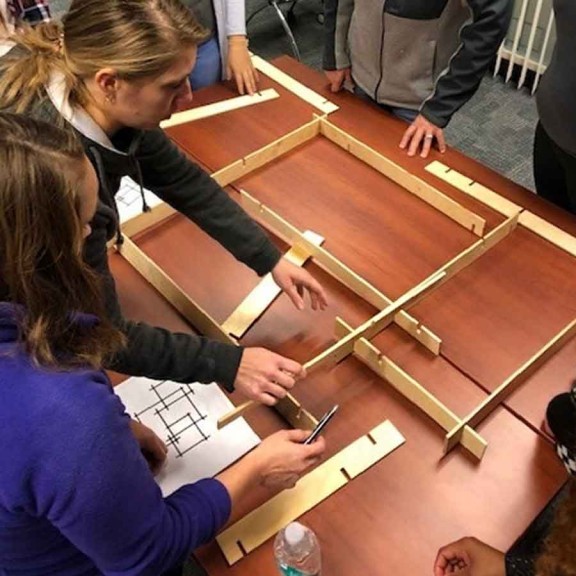 Students building model in class