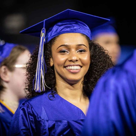 Graduate smiling at camera