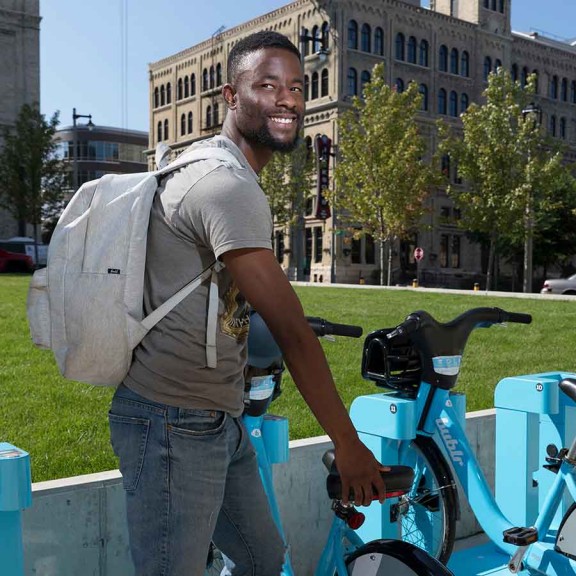Student renting electric bike on campus