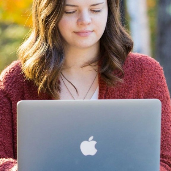 Student on laptop outside